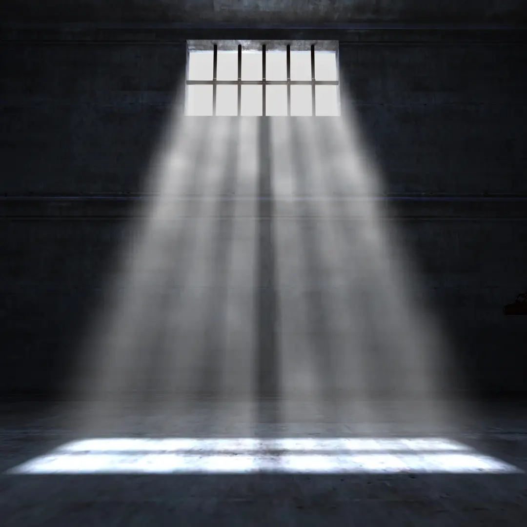 Rendered image of light streaming through a barred window into a dark room.